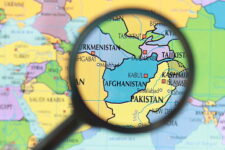 map with Afghanistan and surrounding countries through a magnifying glass