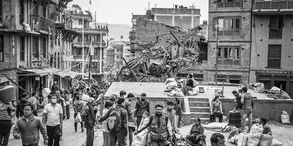 People gathered near destroyed buildings in Nepal