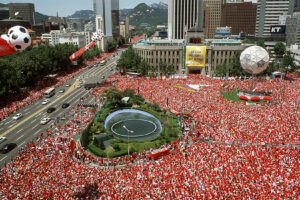 FIFA, Terrorism, and Preparedness for the 2026 World Cup in the U.S. Seoul Plaza 2002 FIFA World Cup massive crowd watching public broadcast of game