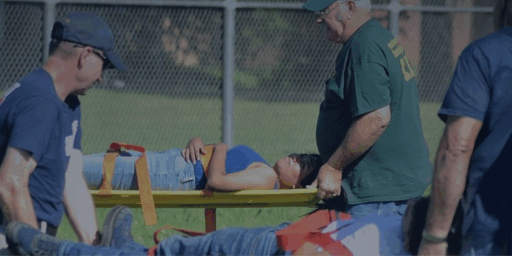 Volunteers training for disaster, carrying stretchers with patients