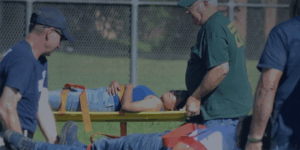 Volunteers training for disaster, carrying stretchers with patients