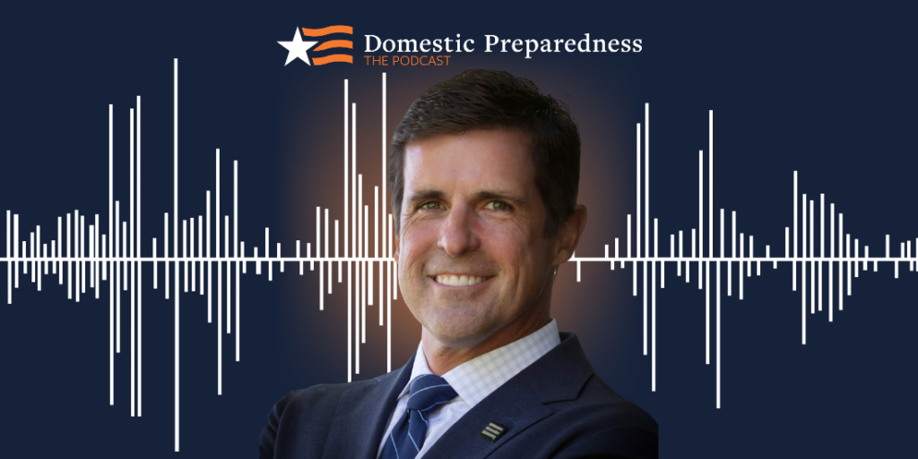 Domestic Preparedness: The Podcast logo above a headshot of Kelley Adley with a sound bar image in the background.